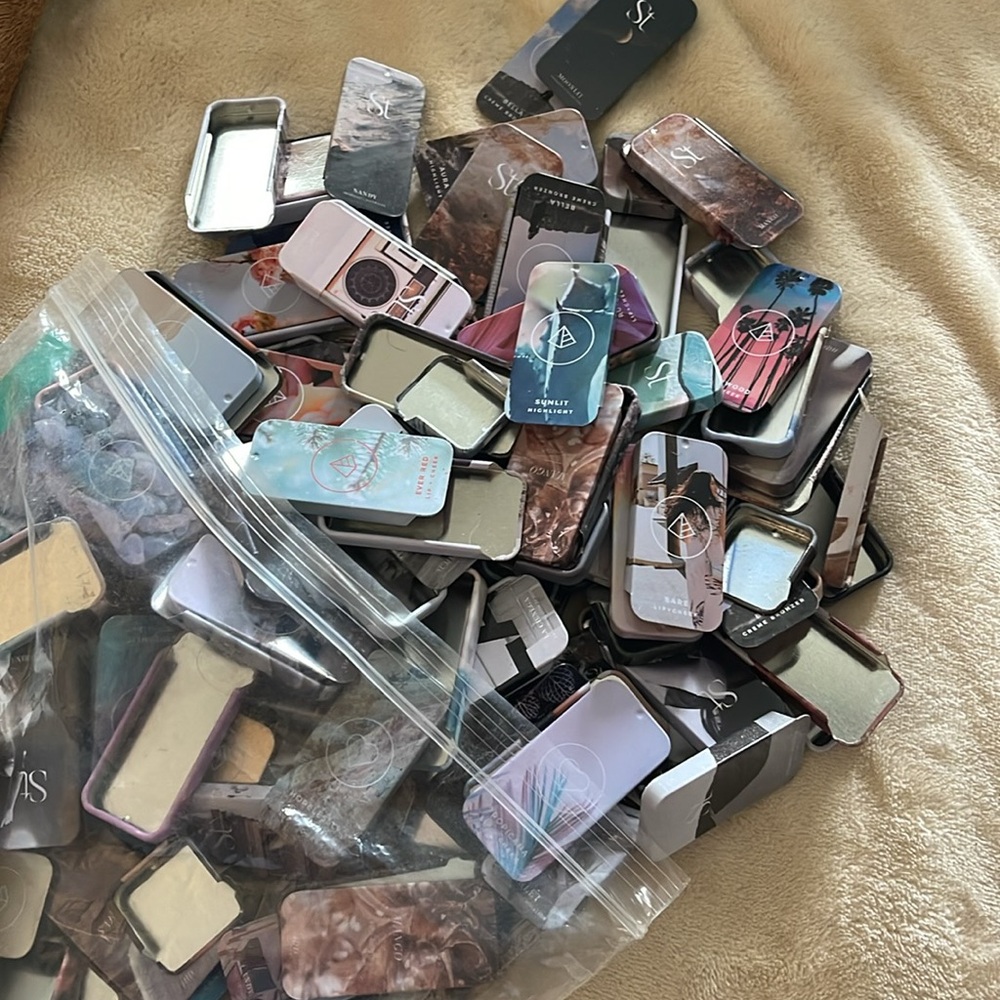 Bag of empty tins from SEINT / MASKCARA